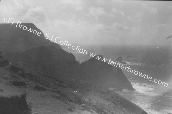 BENWEE HEAD & KID ISLAND ON HORIZON ERRIS HEAD  SEEN AGAINST SUN FROM N.E.